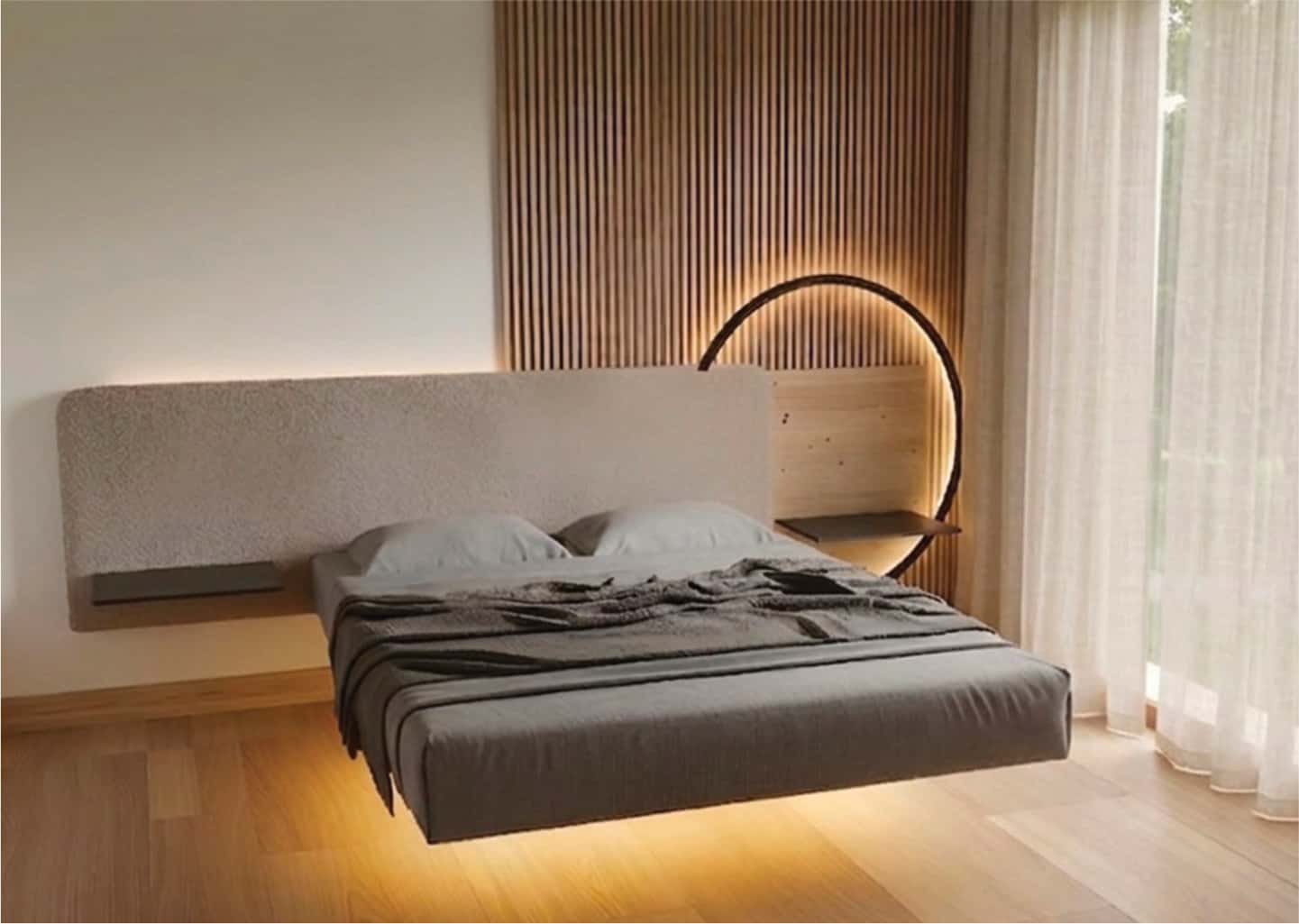 A minimalist bedroom with a floating bed, gray bedding, wooden slat wall, circular light accent, and light wood flooring, next to sheer curtains.