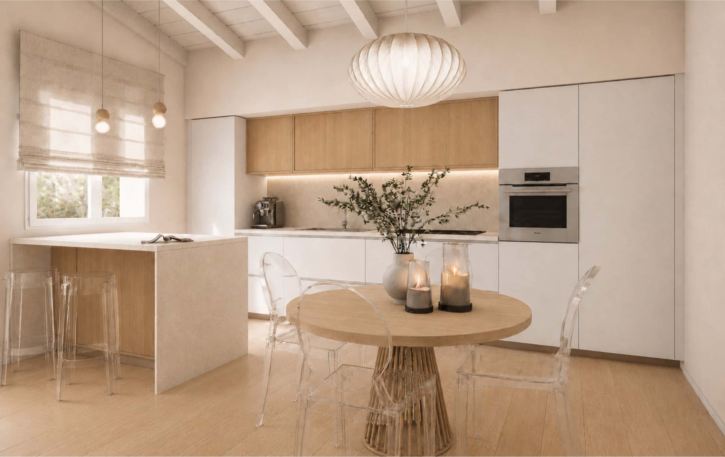 Cucina moderna e luminosa nei toni neutri con tavolo rotondo in legno, sedie trasparenti e penisola snack.